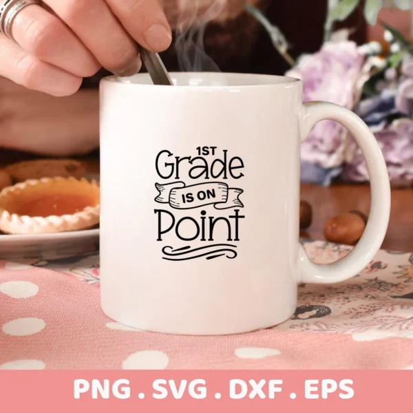 White mug with "1st Grade is On Point" SVG design, a digital file for Cricut and Silhouette.