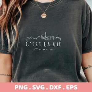T-shirt mockup with "C'est La Vie" SVG design featuring Paris skyline, a digital cut file for Cricut and Silhouette.