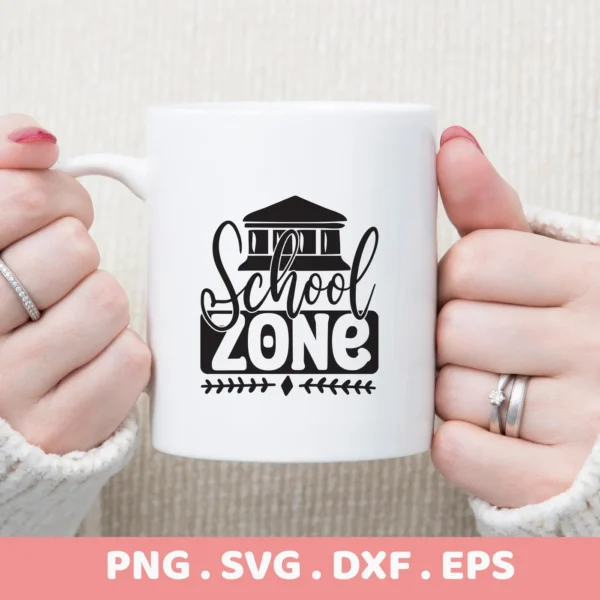 White mug with "School Zone" SVG design, held by hands. Digital file for classroom decor.