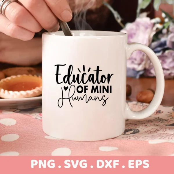 White mug with "Educator Mini Humans" SVG design, part of digital download for teacher gifts.