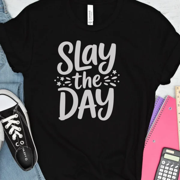 Black t-shirt mockup with "Slay the Day SVG" design, a digital file for Cricut and Silhouette projects.