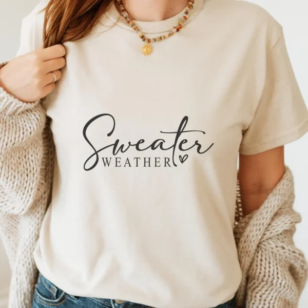 Woman wearing t-shirt with "Sweater Weather" design, a digital SVG file for apparel.